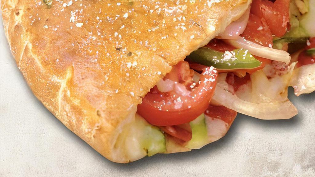 Veggie Calzone · Mushrooms, green peppers, onions, black and green olives, tomatoes, and mozzarella cheese.