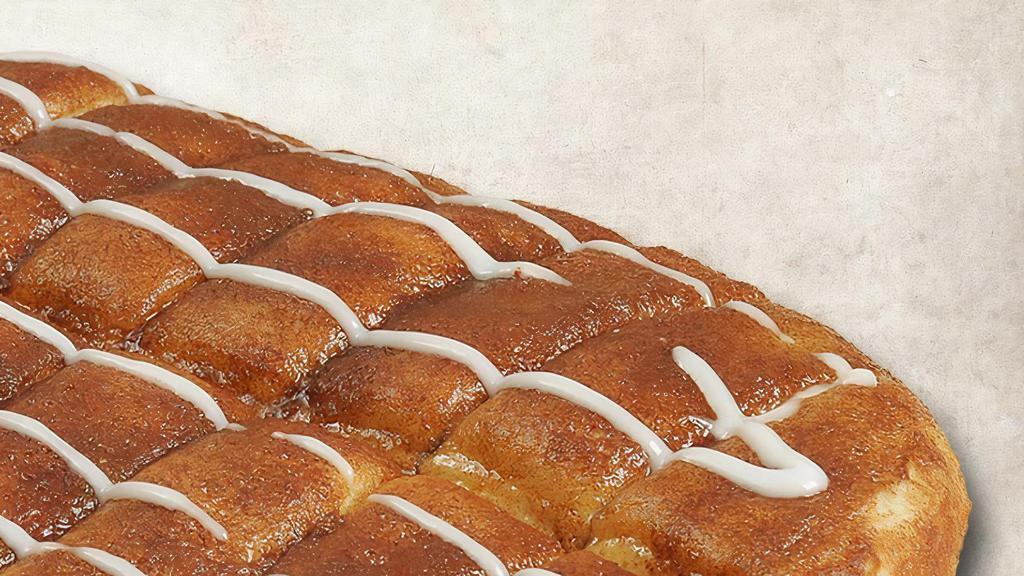 Cinnamon Sticks · Fresh bread covered with a cinnamon-butter blend served with a side of vanilla frosting.