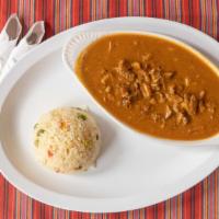 Revolcado · Pork stew made with tongue, heart, liver and ears, with Guatemalan creole sauce, served with...