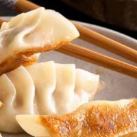 Gyoza (6) · Pan-fried chicken pot stickers filled with and with dipping sauce