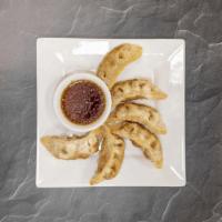 Fried Vegetable Dumpling · Fried tofu, carrots, Napa cabbage red pepper, ginger, scallions, soy sauce hoisin sauce and ...