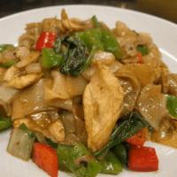 Pad Kee Mao · Stir-fried wide rice noodles served with carrots, white onions, green and red bell peppers &...