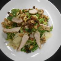 Shaved Brussels Sprouts Salad · Nueske bacon, arugula, toasted walnuts, raisins, shaved parmesan, grilled chicken breast, le...