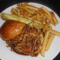 Smokehouse Burger · Smoked gouda, melee BBQ, crispy onions, brioche bun.