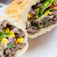 Chees Stake Sub · Oven Roasted Steak with mushrooms, green pepper and onion. Added lettuce, tomato corn, mozza...