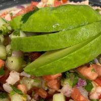 Ceviche De Pescado · Fresh tilapia marinated in lime juice mixed with cucumbers, tomatoes, red onions, cilantro a...