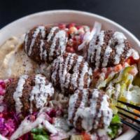 Falafel Bowl · Freshly fried Falafel  with your choice of rice, topped off with your favorite toppings and ...
