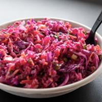 Red Cabbage Salad · Freshly cut red cabbage, tomatoes, green onions, red onions and freshly cooked quinoa with o...