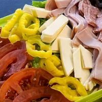 Antipasto Salad · Lettuce, ham, hard salami, cheese, tomato, mild peppers, black olives, with your choice of d...