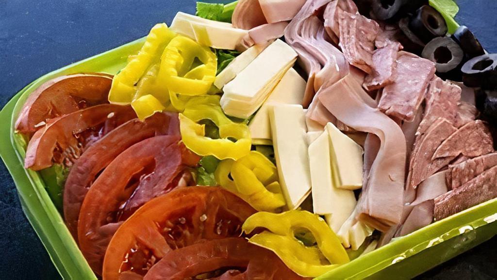 Antipasto Salad · Lettuce, ham, hard salami, cheese, tomato, mild peppers, black olives, with your choice of dressing.