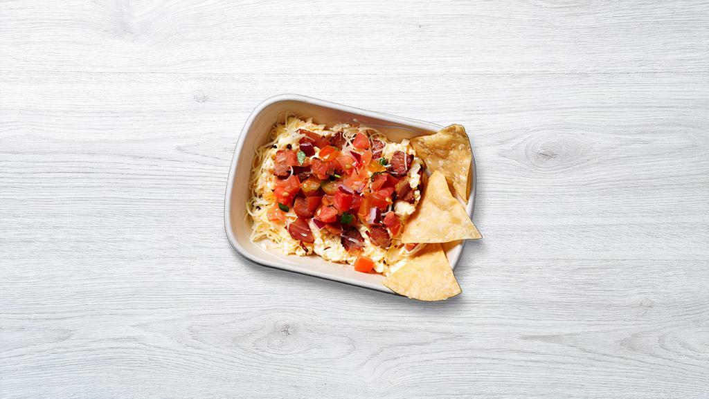 Free Range Scrambled Eggs Bowl · Free range scrambled eggs, Jack Cheese, pico de gallo and your filling of choice.  Served with Guzman y Gomez corn chips.