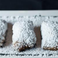 French Quarter Beignets · Served w/ cognac infused strawberry sauce.