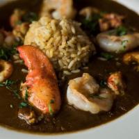 Shellfish Étouffée · Gulf shrimp, lobster, sea scallops and crawfish tails, trinity, caramel roux, and rice.