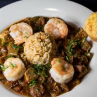Creole Jambalaya · Chicken, Becher Meats Andouille Sausage, Tasso Ham, Gulf shrimp, trinity, tomato, and rice.