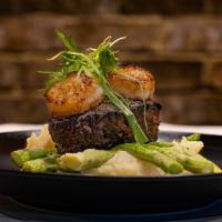 Surf And Turf · 8 oz. Choice Black Angus Steer filet, Jumbo Sea scallops, whipped Yukon gold potatoes, and f...