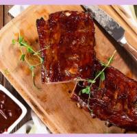 Baby Back Ribs · These Baby Back Ribs are fall of the bone tender and ONO!   Sweet Guava BBQ is layered on to...