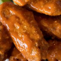 Jumbo Chicken Wings · Served with choice of ranch or bleu cheese dressing, celery sticks.  Choice of breaded or gr...