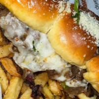Beef Philly Sliders · Beef Philly Sliders served with Grilled peppers & onions and mozzarella cheese.