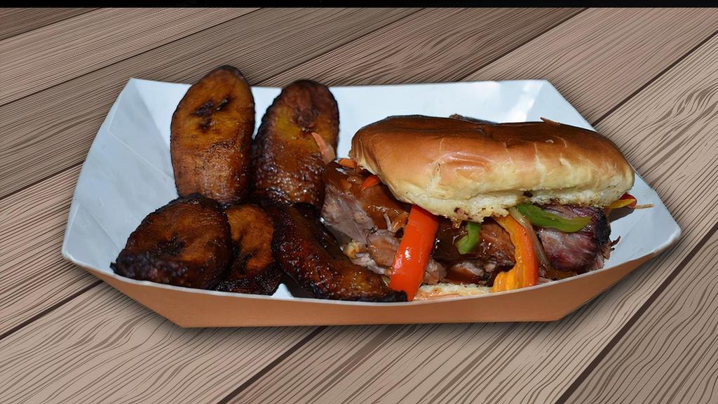 Pulled Pork Sandwich · Smoked pimento spiced jerk pork. Served on a bun. Topped with Cole slaw.  Served with your choice of fries or sweet plantains and sauce.