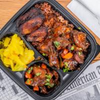 Brown Stew Chicken · Boneless chicken leg quarters seasoned with Jamaican herbs, spices braised and slow-cooked.