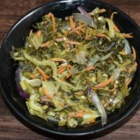 Callaloo · Jamaican Callaloo  stir fried with onion, garlic, bell peppers, thyme and pepper.