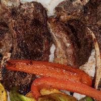 Lamb Chops · Four Tender Lamb chops served with sautéed vegetables and choice of two sides.