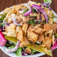 Large Fattoush · Vegetarian. Lettuce, Tomatoes, Cucumbers, Cabbage, Carrots, Pita Chips and Homemade Fattoush...
