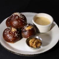 Pretzel Roll & Beer Cheese Dip · Our signature warm pretzel rolls served with white cheddar beer cheese dip