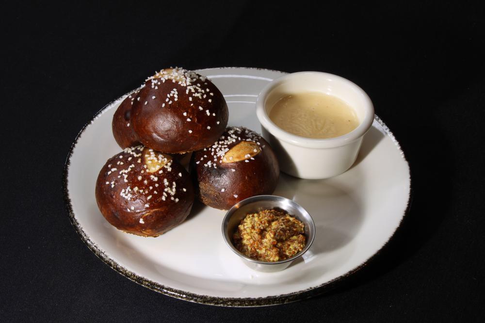 Pretzel Roll & Beer Cheese Dip · Our signature warm pretzel rolls served with white cheddar beer cheese dip