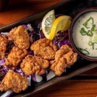 Kobra Karaage Fried Chicken Bites · Japanese-fried chicken on a bed of fresh cabbage and served with Tokyo Ranch.