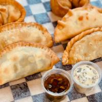 Argentine Chorizo Empanada · Che Chori Argentine chorizo, onions, and cheese. Comes with a side of house-made ChimiMayo s...