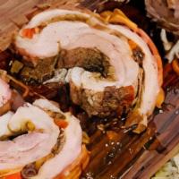 Porchetta Sandwich · Chopped-Up Pork belly seasoned and marinated. Stuffed with prosciutto, plums, etc. Rolled an...