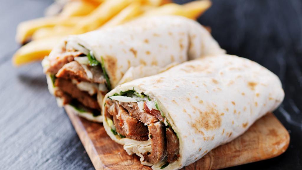 Mediterranean Wrap · Delicious Wrap made with Grilled chicken, spinach, feta cheese, hummus, avocado and tomato. Served with a side of tzatziki sauce.