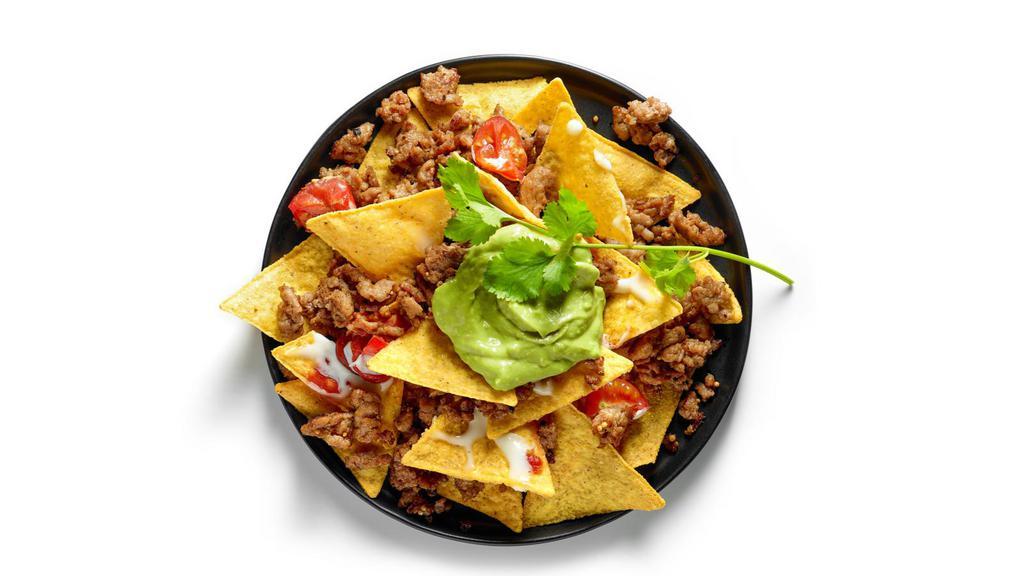 Chili & Cheese Nachos · Nachos topped with a House special chili, and delicious gooey cheese sauce.