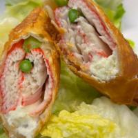 Crab Roll Appetizer · Crab, cream cheese, asparagus roll with green salad and yum yum sauce on the side
