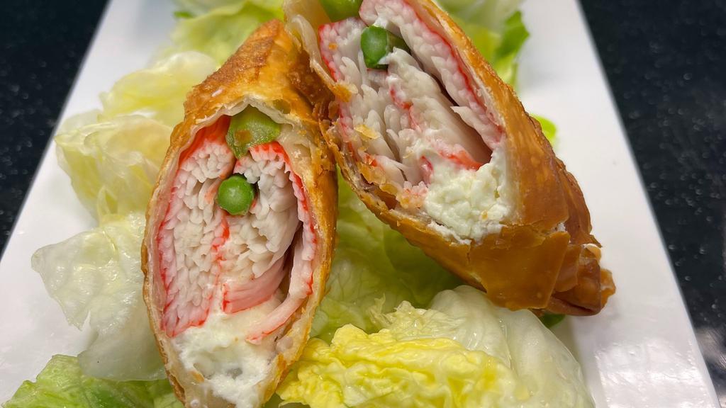 Crab Roll Appetizer · Crab, cream cheese, asparagus roll with green salad and yum yum sauce on the side