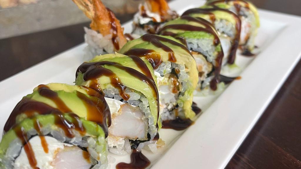 Caterpillar Roll · Shrimp tempura, crab salad, cream  cheese top with avocado and eel sauce