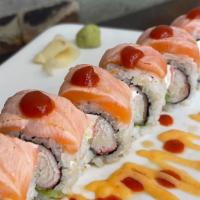 Alaskan Roll · Crab stick, cream cheese, avocado, top with salmon torched, spicy mayo, eel sauce and srirac...