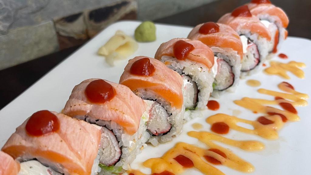 Alaskan Roll · Crab stick, cream cheese, avocado, top with salmon torched, spicy mayo, eel sauce and sriracha.