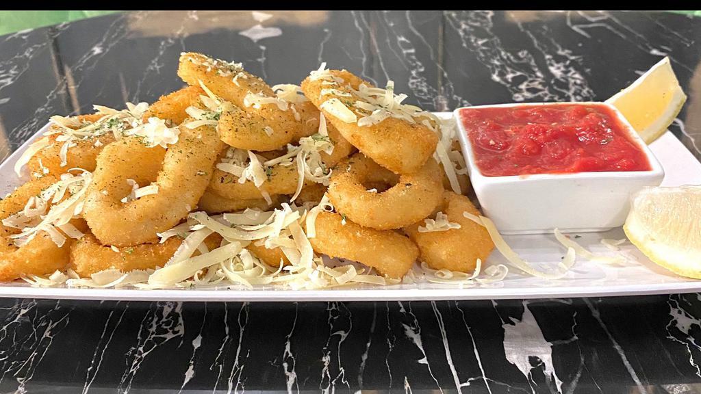 Calamari · Panko battered calamari, lightly fried and seasoned with fresh black pepper, parsley and fresh shaved parmesan cheese.  Served with a side of our famous san marzano marinara and two wedges of lemon.