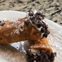 Mini Cannoli · One hand piped cannoli filled with rich ricotta cheese custard, then rolled in mini chocolat...