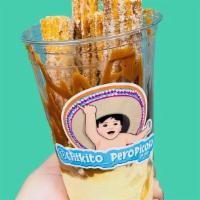 Red Head Churro Sundae · 4 Cajeta Filled Churro sticks with dulce de leche syrup, marzipan crumbs, ice cream, whip cr...
