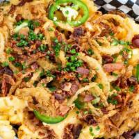 Mosh Pit Fries · Crinkle Cut fries loaded with Liquid Gold, bacon, jalapeno, and fried onions
