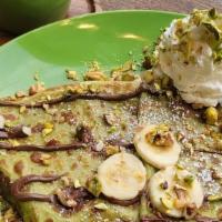 Matcha Crepe · Matcha Crepe with Nutella, strawberries  & coconut flakes 
Served with whipped cream