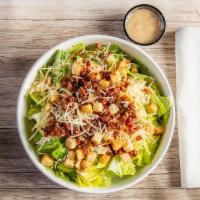 Caesar Salad · Crisp romaine lettuce, toasted garlic croutons & shredded parmesan cheese + Caesar dressing