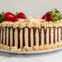 Mocha Vanialla Cake (Signature) · A rich vanilla cake with whipped cream mocha frosting and a layer of mocha and custer cream.