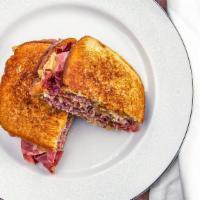 The Ruben · Hot extra lean corn beef, with melted Swiss cheese, covered with thousand Island dressing, s...