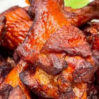 Naked Wings · One dozen brined and fried chicken wings (not breaded) tossed in choice of Smokeheads Buffal...