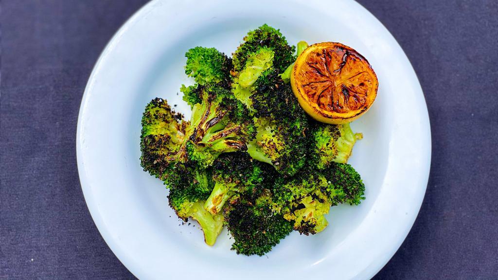 Roasted Broccoli · Broccoli tossed in garlic and lemon, charred to perfection.