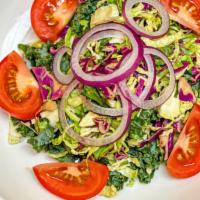 Garden Salad · Kale, red cabbage, Brussels sprouts, tomatoes, red onion. Served with balsamic vinaigrette o...